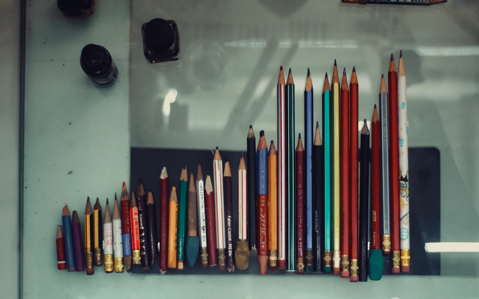Colored pencils arranged on a surface