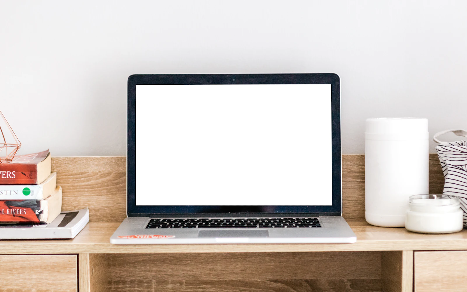 Turned-on MacBook on desk