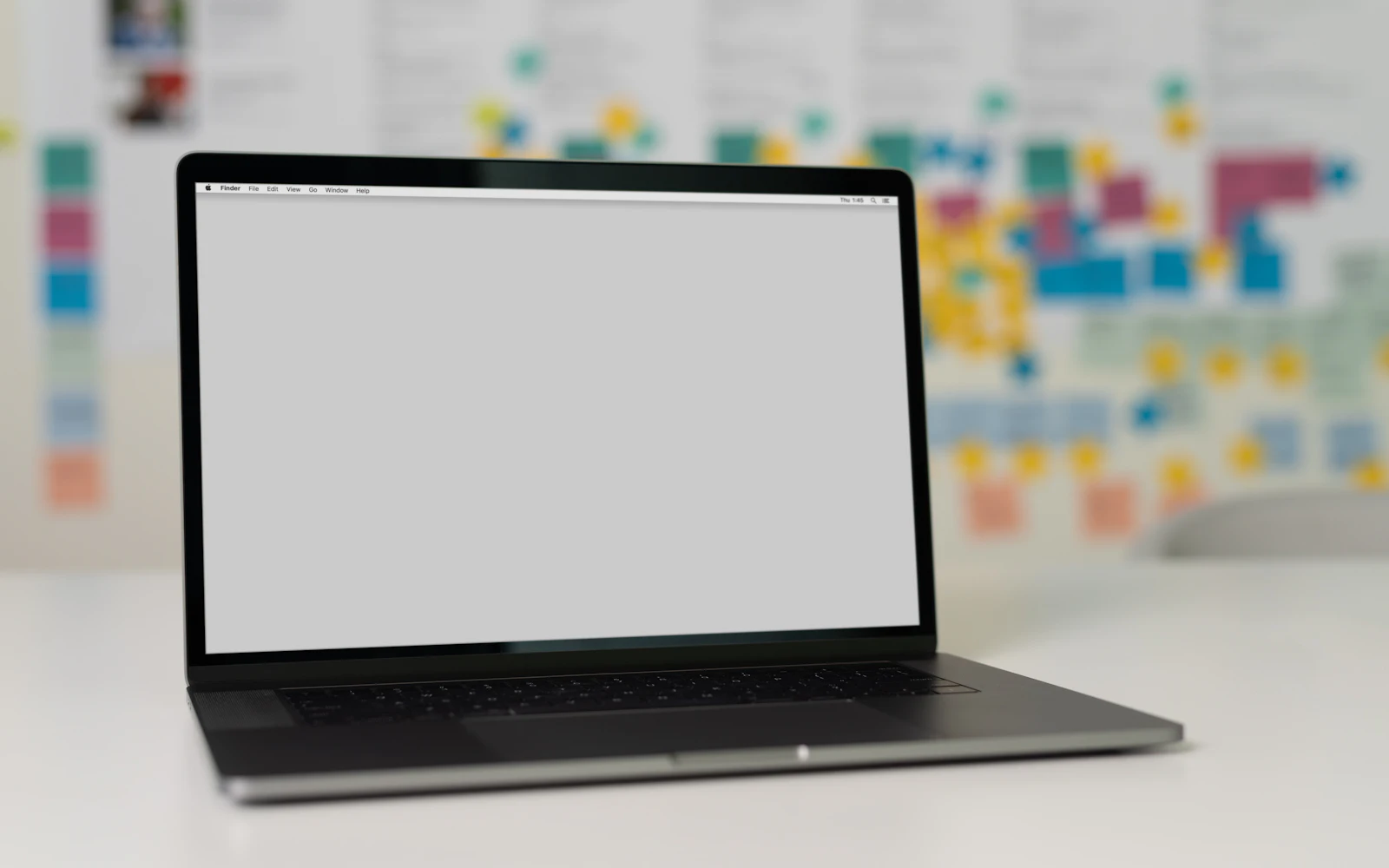 Macbook pro on white table