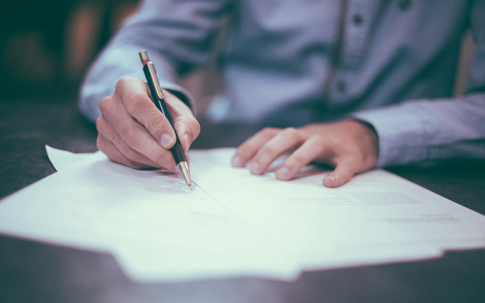 Man writing on paper