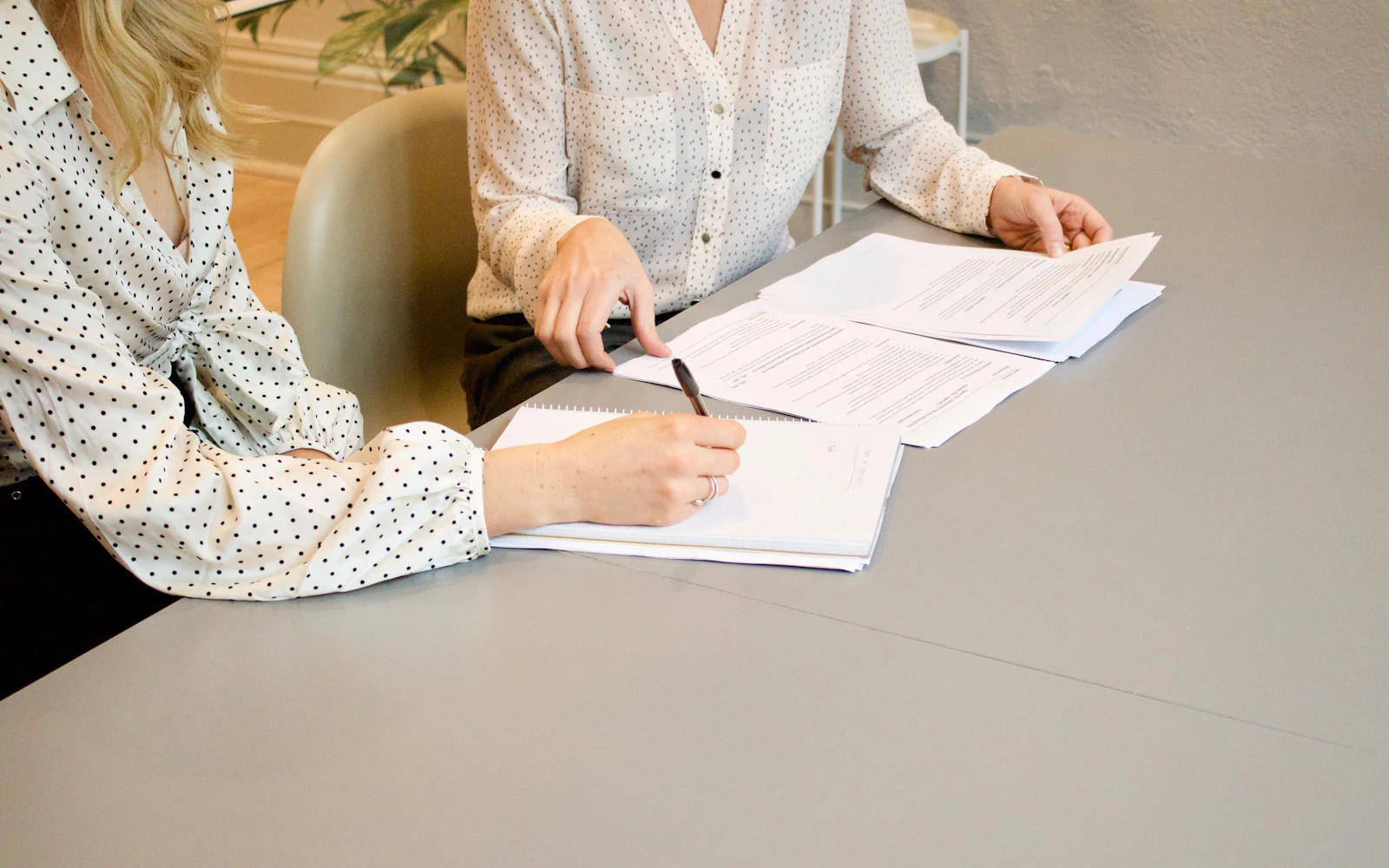 Woman signing paper