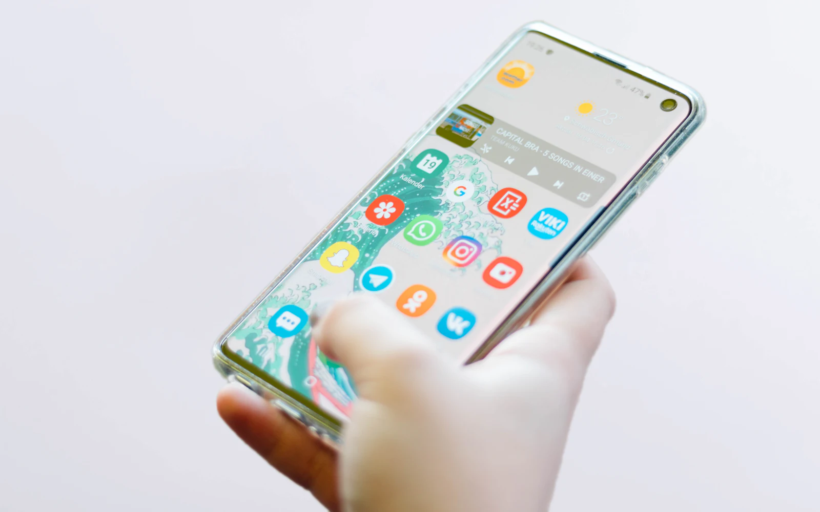 Person using silver Android smartphone