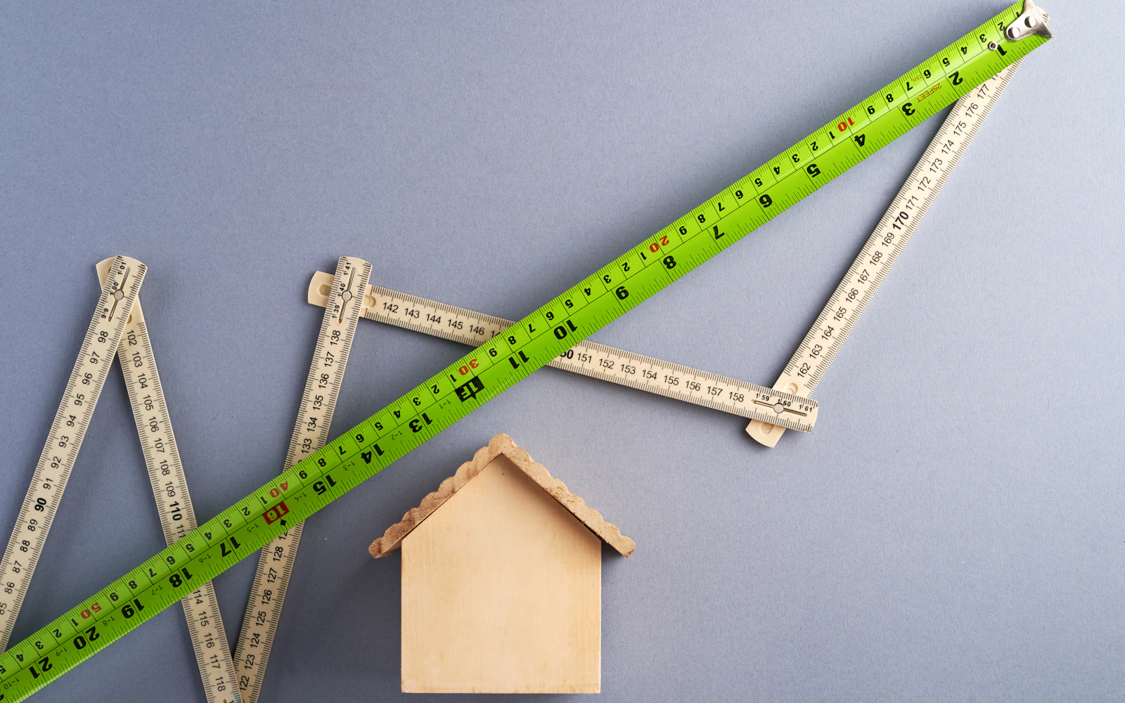 Green ruler on white surface