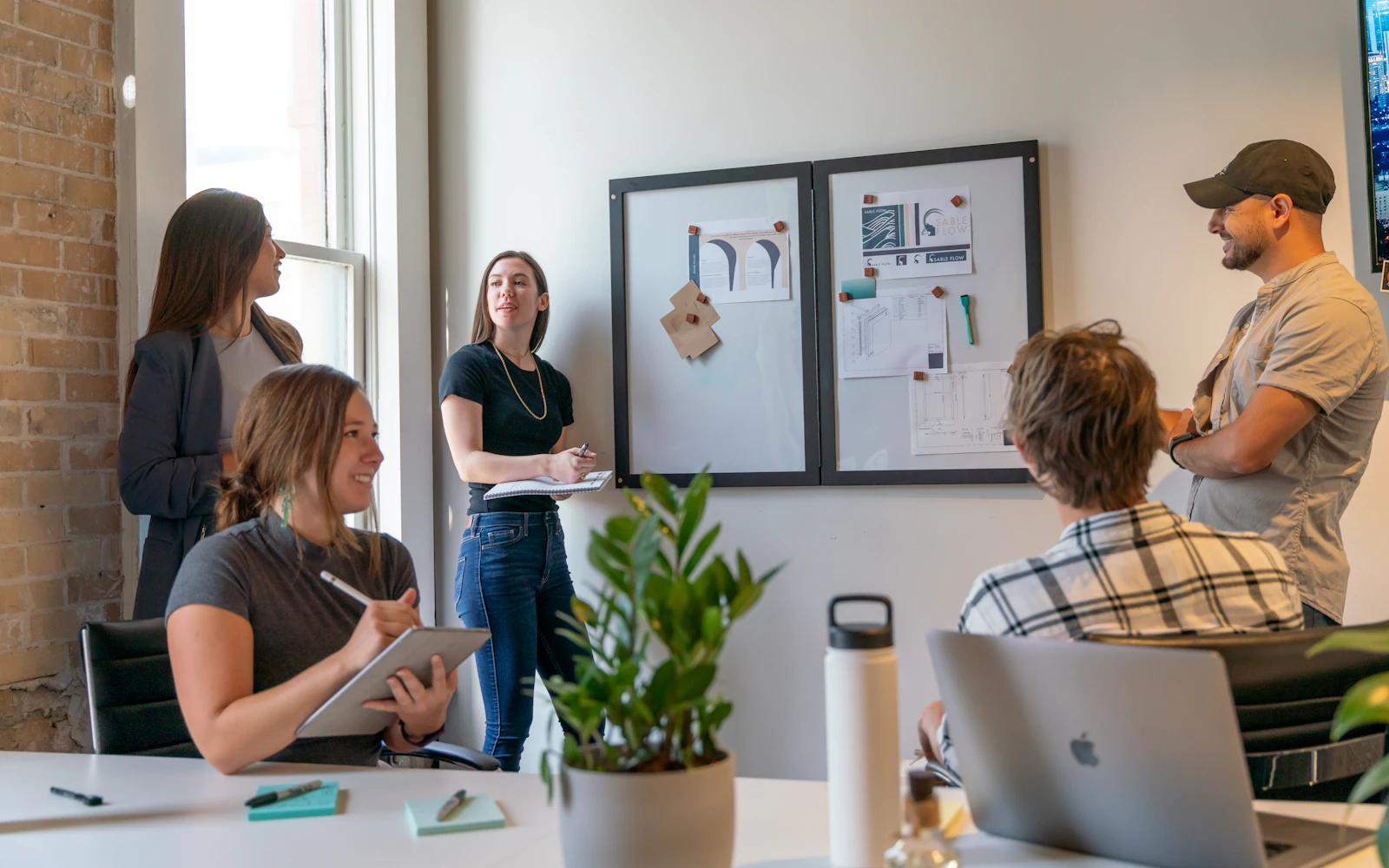 People in a sunlit office meeting