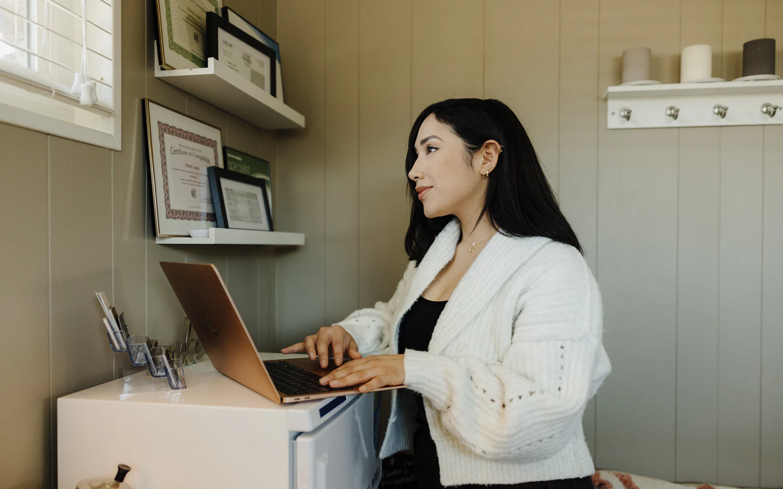 Woman at a desk using a laptop