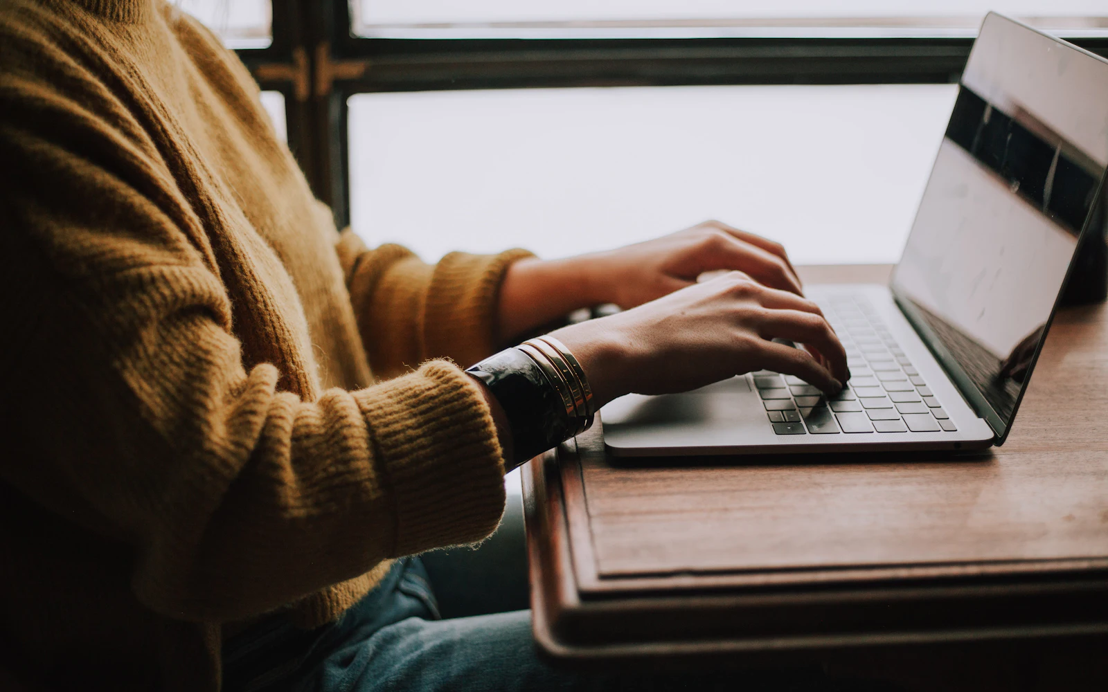 Person sitting in front of laptop