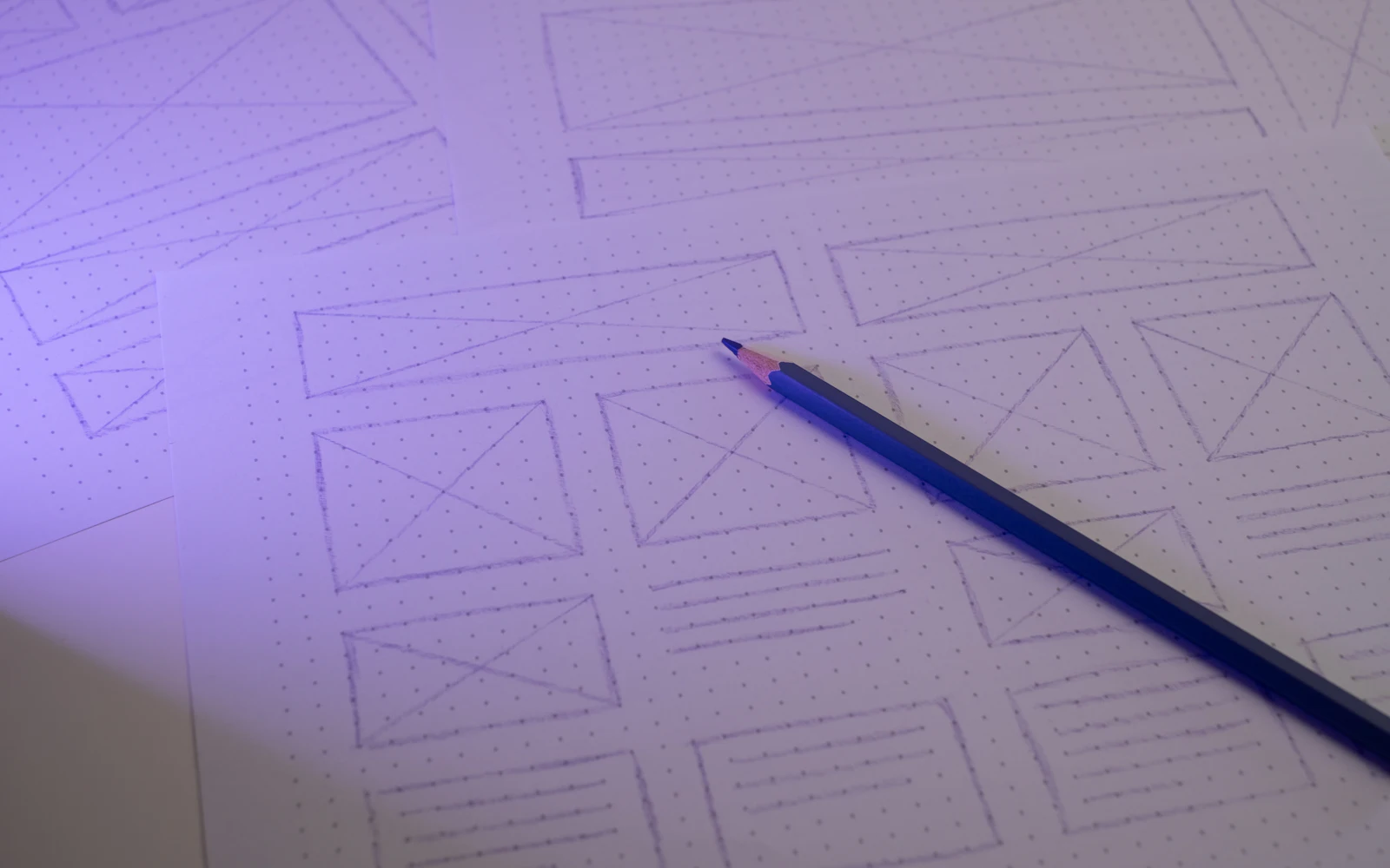 Pencil on dot grid paper with hand drawn website