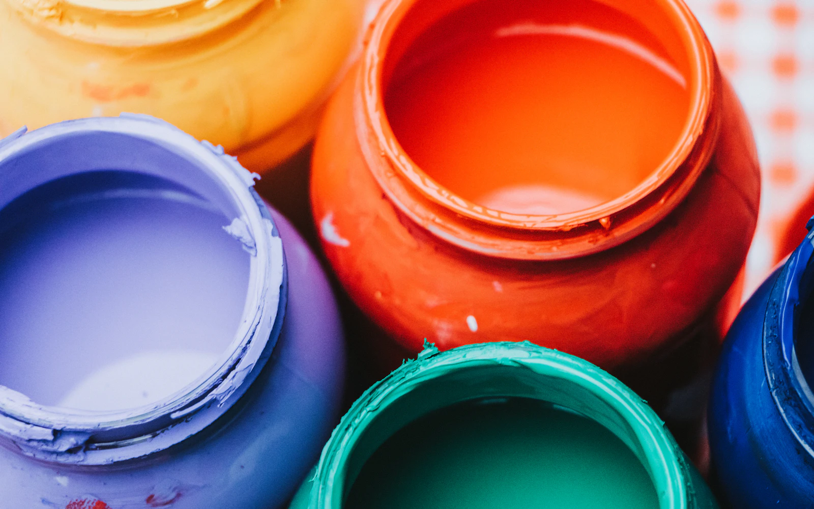 A close up of a group of paint cans