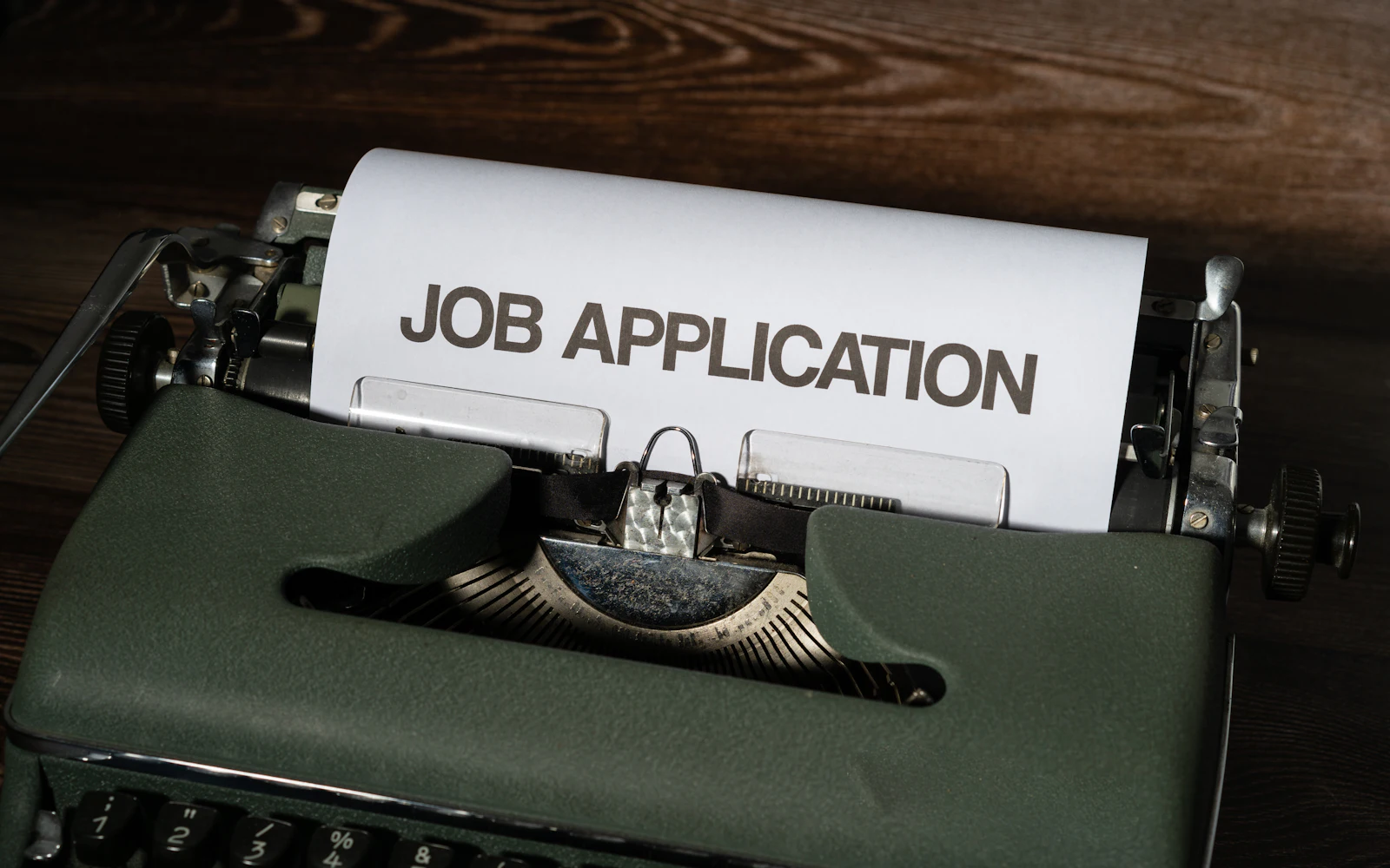 A typewriter with a job application in it