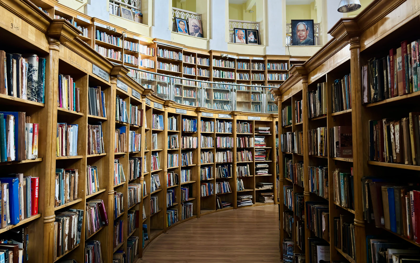 A long row of bookshelves filled with books